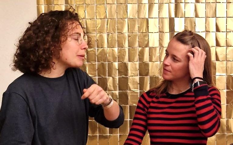 Two people talking at a Connect Bern event