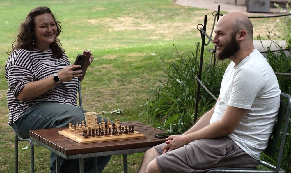 Two people talking at a Connect Bern event
