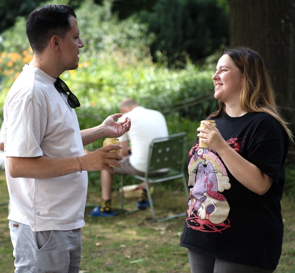 Two people talking at a Connect Bern event