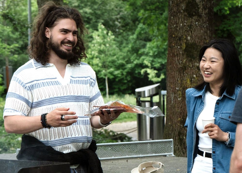Two people talking at a Connect Bern event