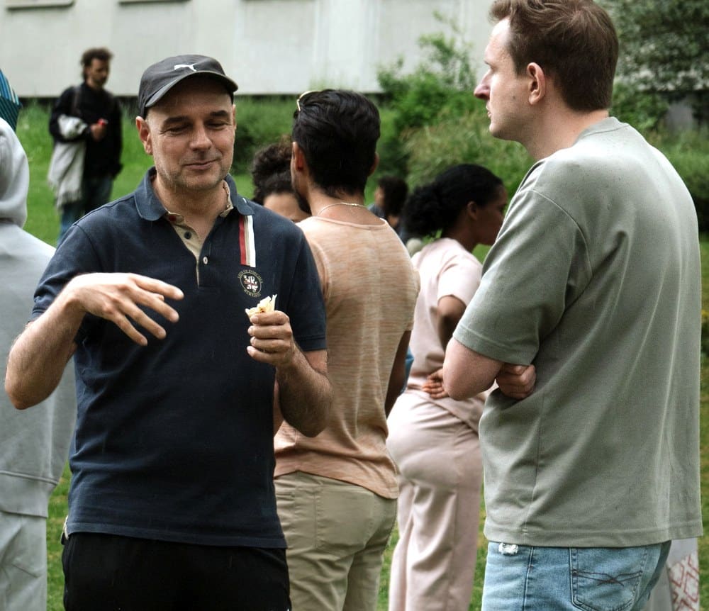 Two people talking at a Connect Bern event